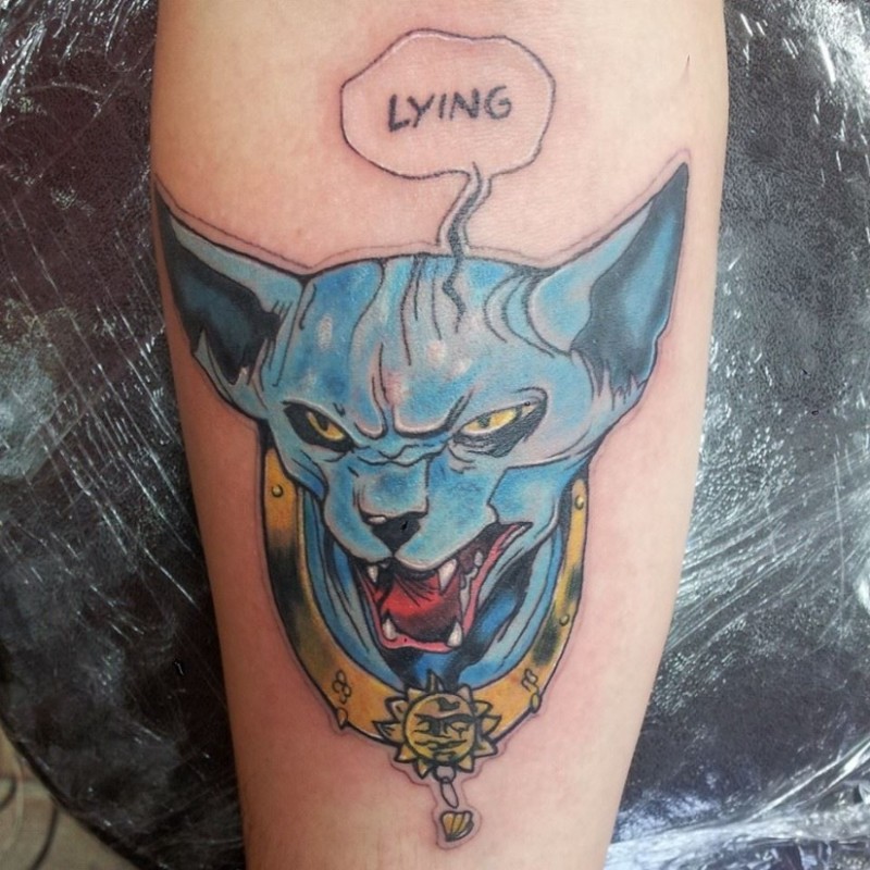 Cute cartoon like colorful cat tattoo on forearm with lettering