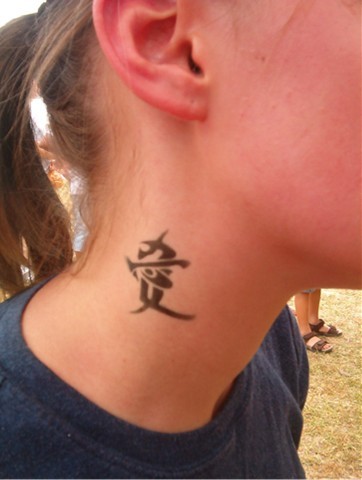 Cute chinese tattoo with symbol on neck