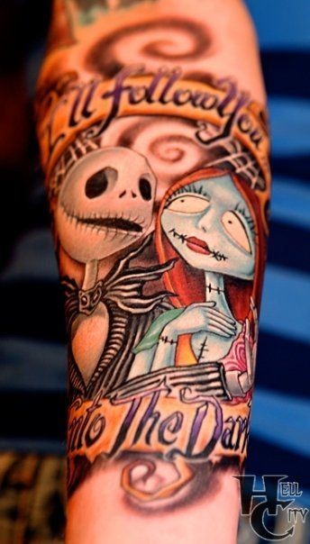 Cute colored cartoon monster heroes tattoo on arm with lettering