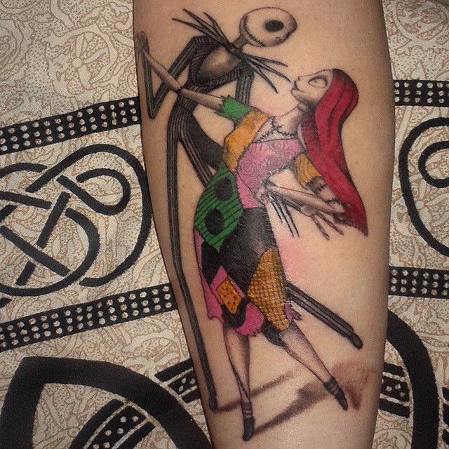 Cute colorful detailed forearm tattoo of dancing monster couple