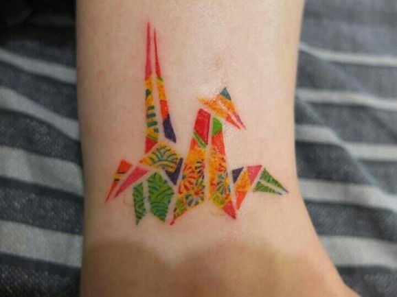 Cute coloured origami bird tattoo