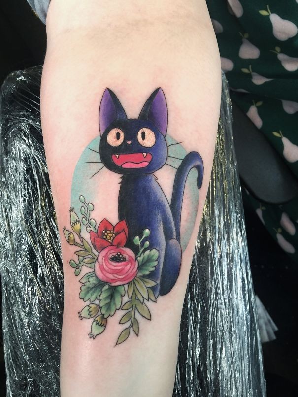 Cute for girls cartoon style colored arm tattoo of funny cat with flowers