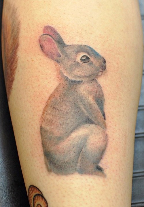 Cute girly gray hare tattoo on shin