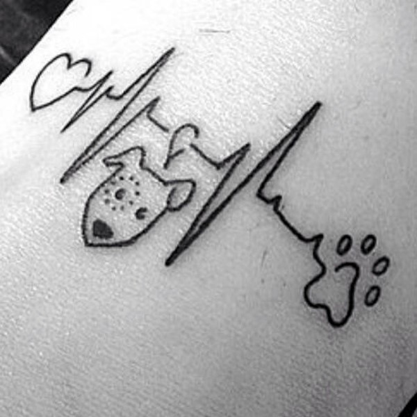 Cute homemade like black ink funny painted heart rhythm tattoo on arm