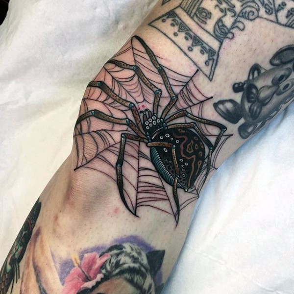 Cute illustrative style beautiful looking spider tattoo on knee