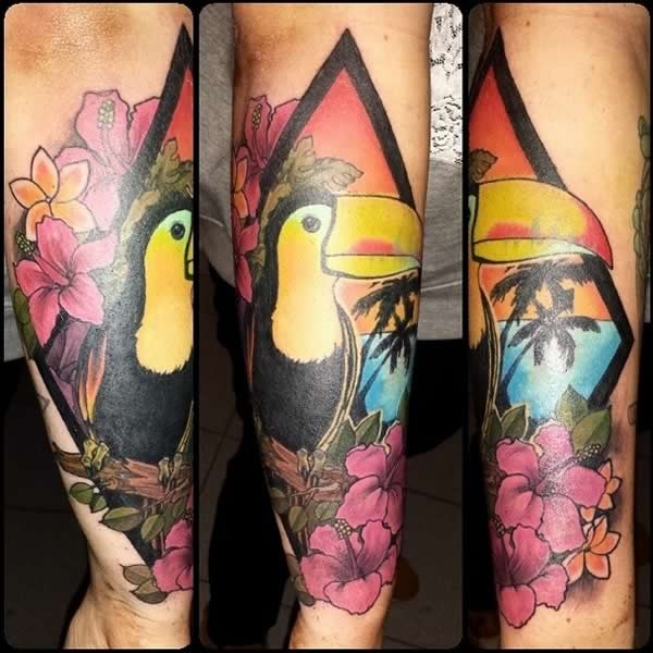 Cute illustrative style colored parrot tattoo on forearm with flowers and palm trees