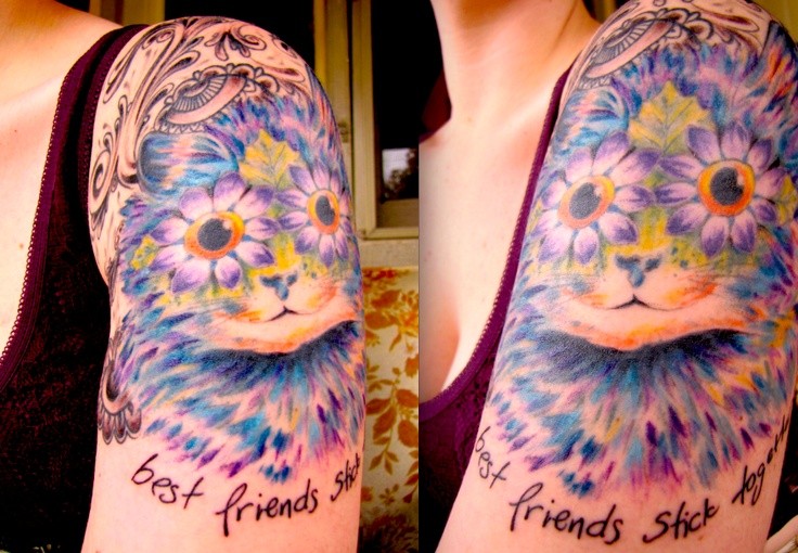 Cute illustrative style colored shoulder tattoo of funny cat combined with lettering