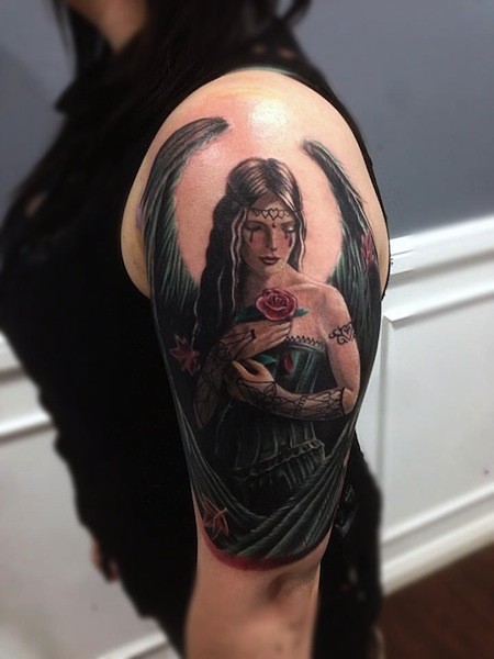 Cute illustrative style shoulder tattoo of seductive angel woman