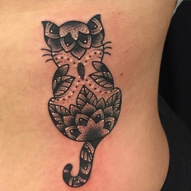 Cute little for girl style tattoo of cat stylized with leaves