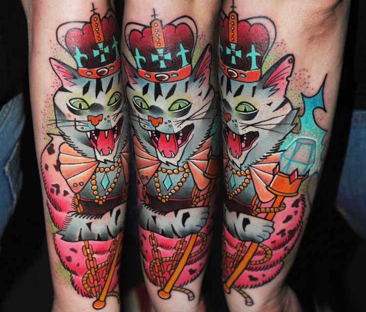 Cute looking cartoon style arm tattoo of king cat with diamonds