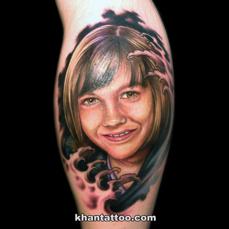 Cute looking colored leg tattoo woman portrait