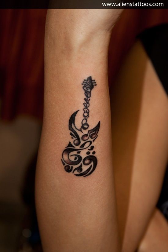 Cute original painted black and white guitar shaped tattoo on arm