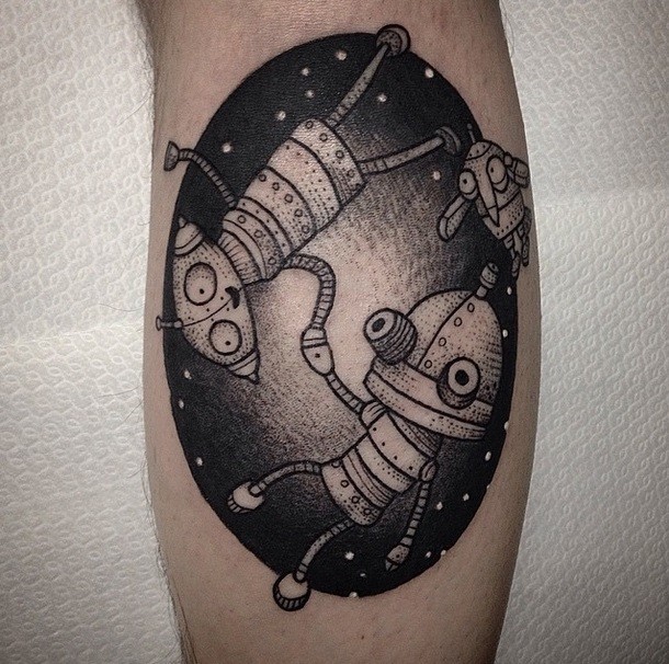 Cute oval shaped black ink tattoo of funny space robots on leg