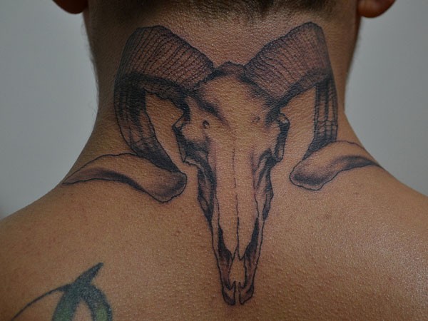 Cute ram tattoo on neck