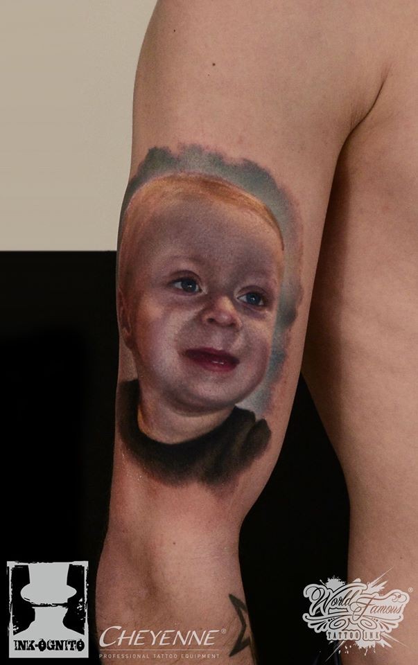 Cute realism style colored shoulder tattoo of funny boy portrait