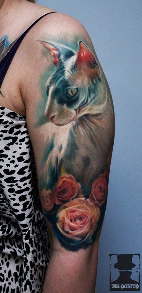Cute realistic looking shoulder tattoo of nice cat with roses