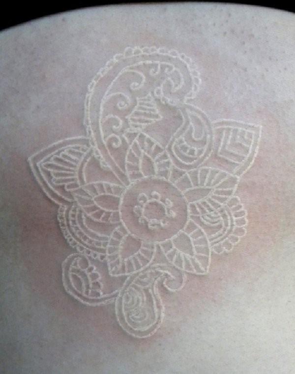 Cute white ink flower tattoo