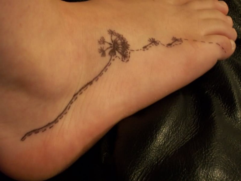 Dandelion flower tattoo on right foot