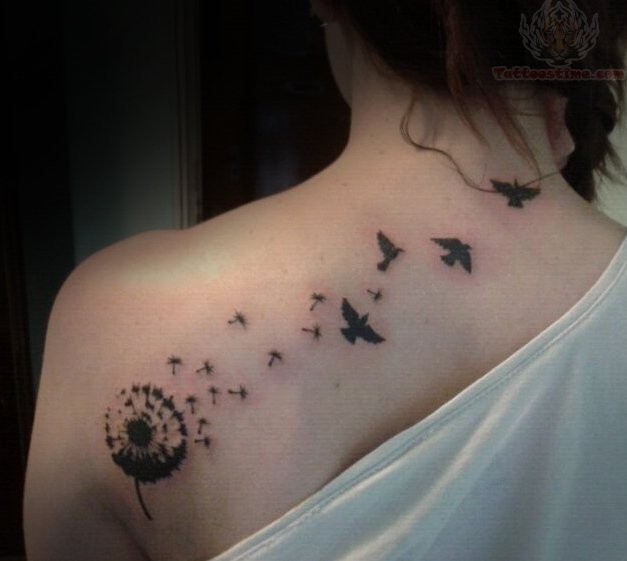 Dandelion puffs and birds tattoo on upper back