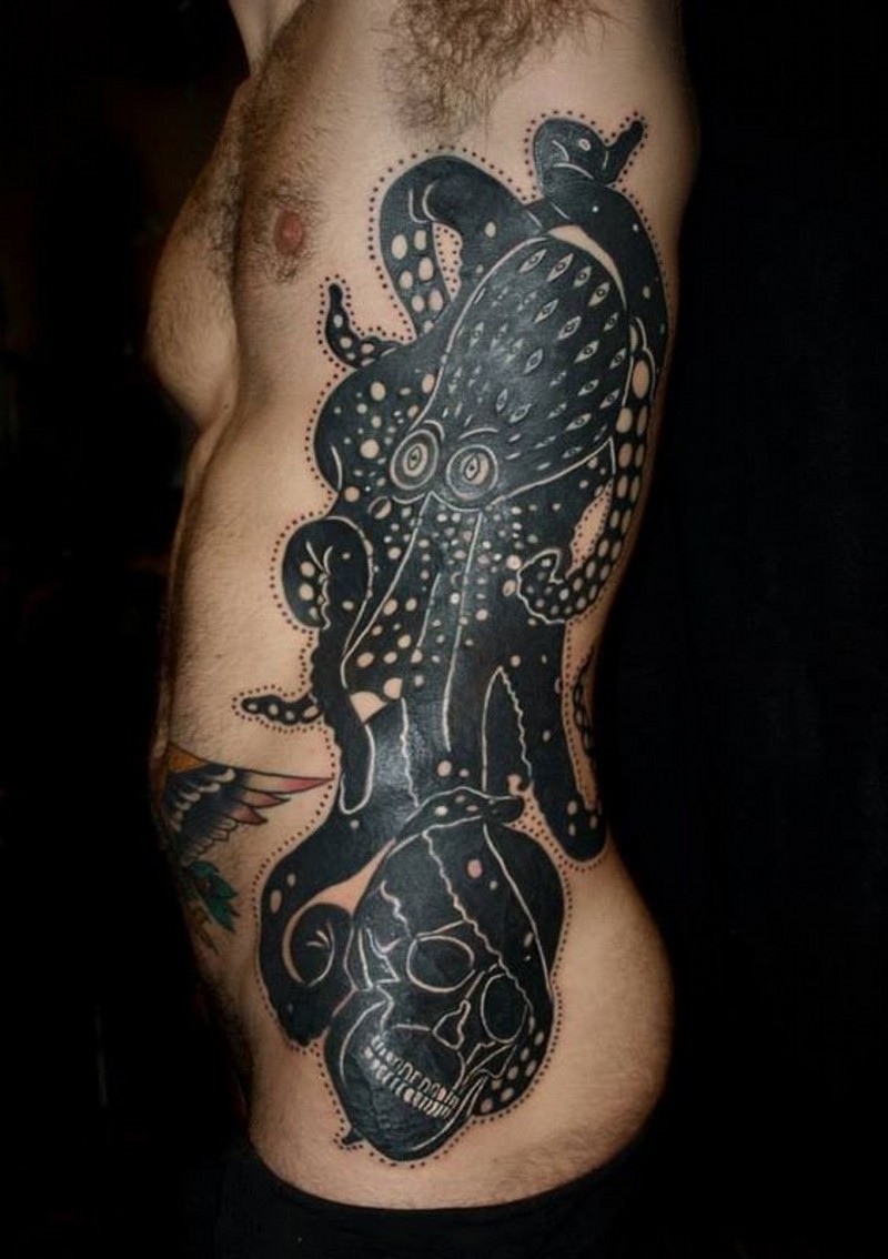 Dark black and white giant octopus with human skull side tattoo with dots