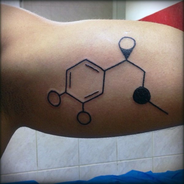 Dark black ink neat chemical formula tattoo on man&quots biceps