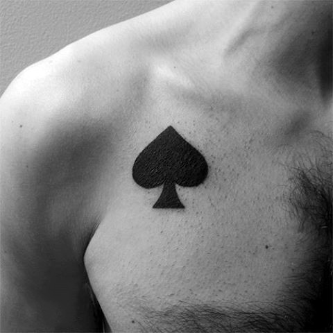 Dark black ink spades symbol tattoo on chest