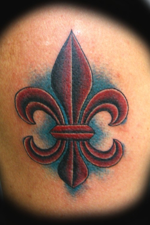 Dark burgundy fleur de lis tattoo