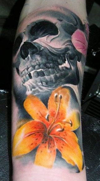 Dark skull with yellow tiger lily tattoo