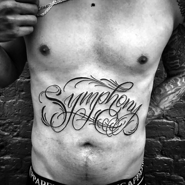 Designed dark black ink lettering Symphony belly tattoo with curls