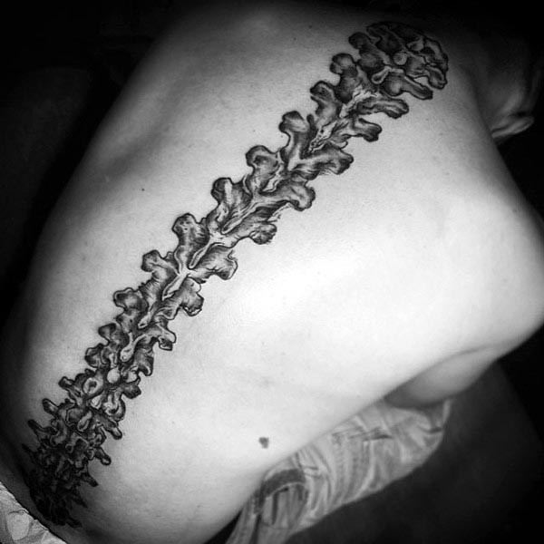 Detailed anatomic spine bones black and white tattoo