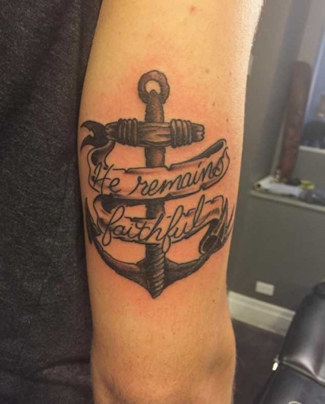 Detailed anchor with memorial banner lettering shoulder tattoo