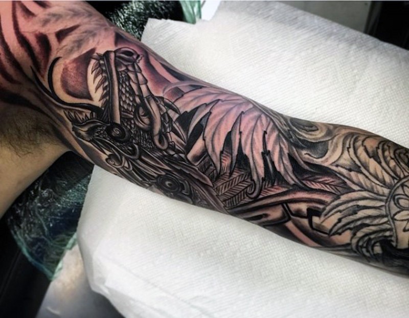 Detailed black and white sleeve tattoo of dragon combined with flowers and leaves