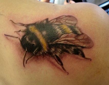 Detailed bumblebee tattoo on shoulder