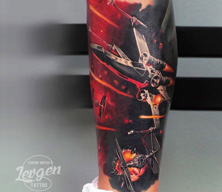 Detailed colorful leg tattoo of Star Wars space ship