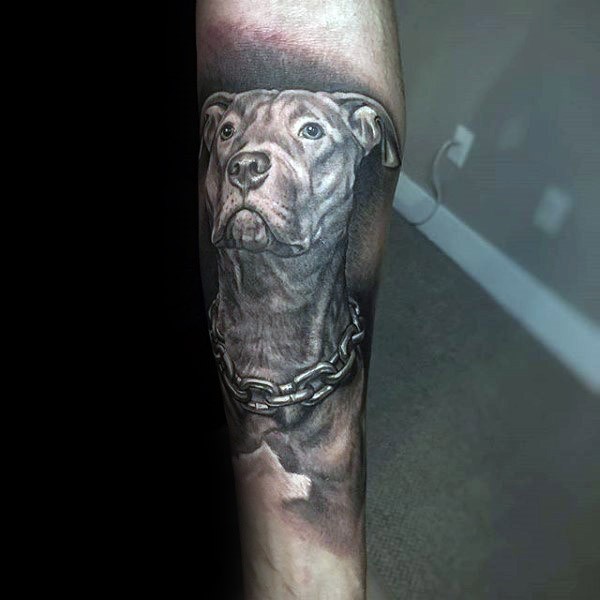 Detailed realism style arm tattoo of dog with chain