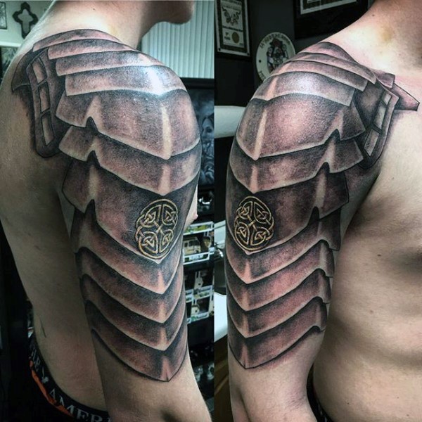 Detailed shoulder tattoo of medieval shoulder armor with knots