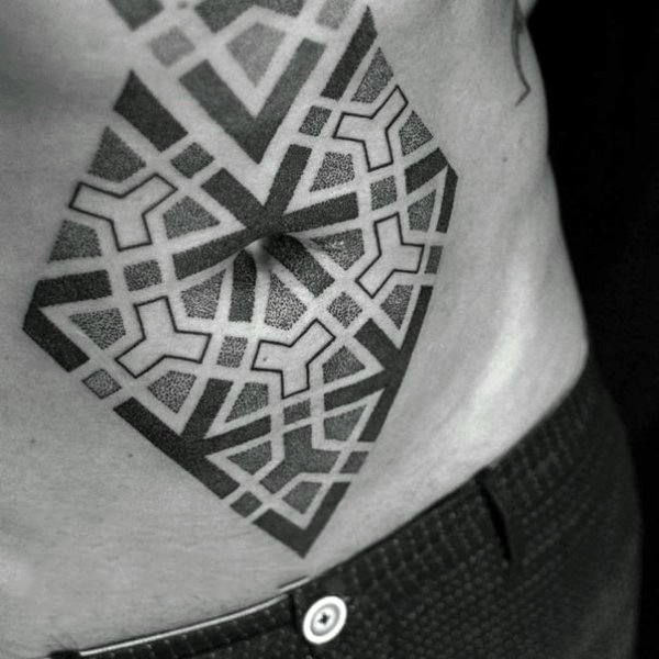 Dot style black in geometrical ornaments tattoo on belly