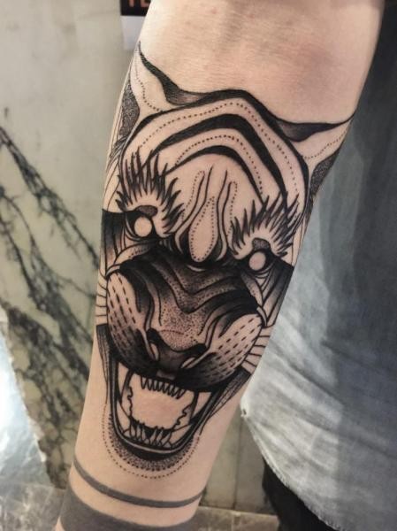 Dot style black ink forearm tattoo of demonic tiger