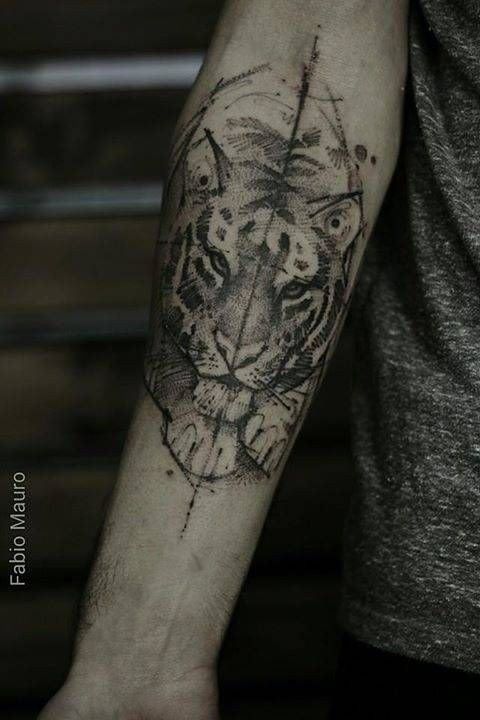 Dot style black ink forearm tattoo of tiger head