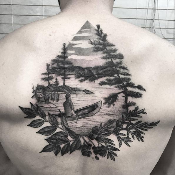 Dot style black ink upper back tattoo of man in small boat combined with leaves and trees