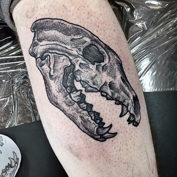 Dot style medium size leg tattoo of big animal skull