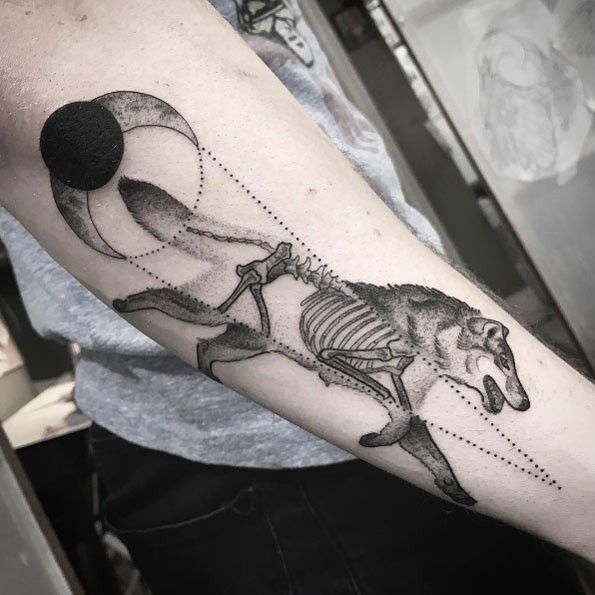Dot style X-Ray like black ink forearm tattoo of running wolf with moon