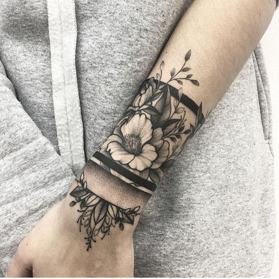 Dotwork style amazing detailed wrist tattoo of flowers