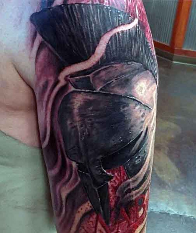 Dramatic 3D colored bloody Spartan warrior helmet tattoo on shoulder