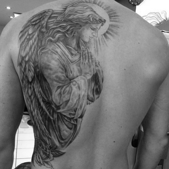 Dramatic black ink detailed praying angel tattoo on half back
