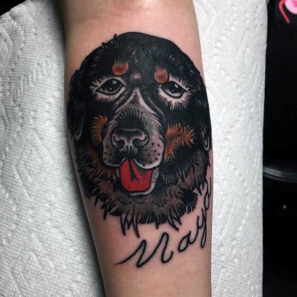 Dramatic like memorial dog portrait with lettering tattoo on arm