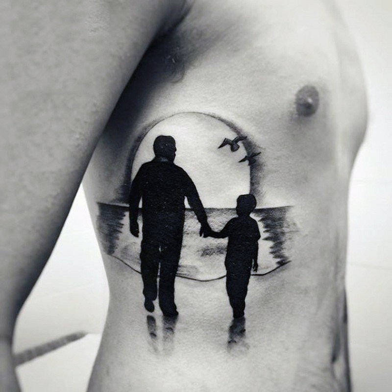 Dramatic style black and white father and son with sunset tattoo on side