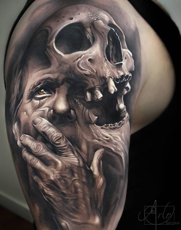 Dramatic very detailed upper arm tattoo of old man with skull