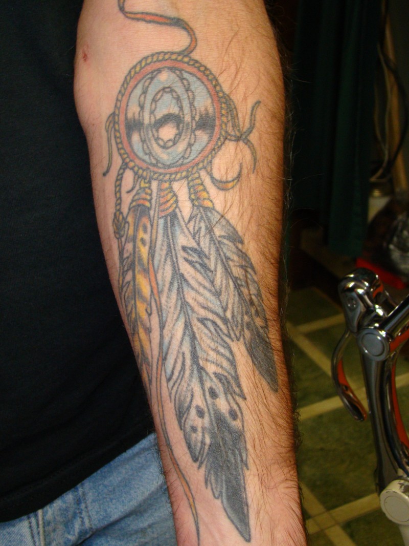 Dreamcatcher with feathers forearm tattoo