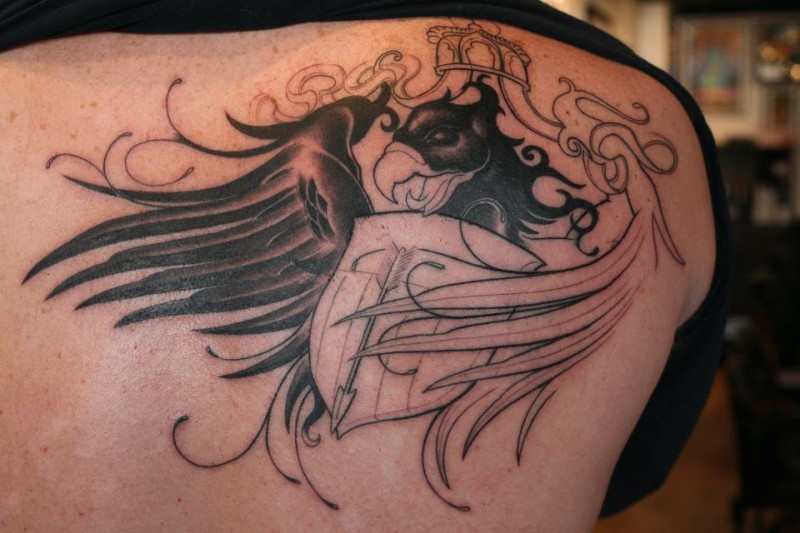 Eagle with shield and arrow tattoo on shoulder blade